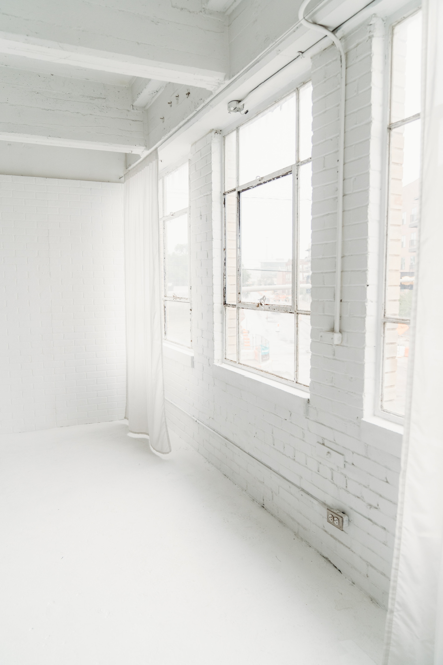 The Loft — white room with afternoon light